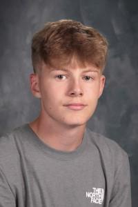 student with tan shirt