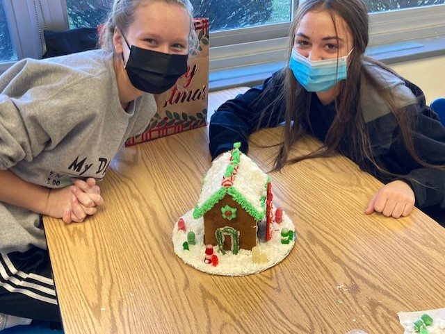 Studnets showing off their ginger bread houses