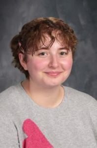 student with curly hair