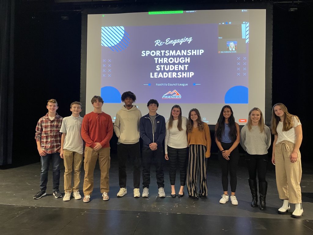 group of 10 students standing on stage