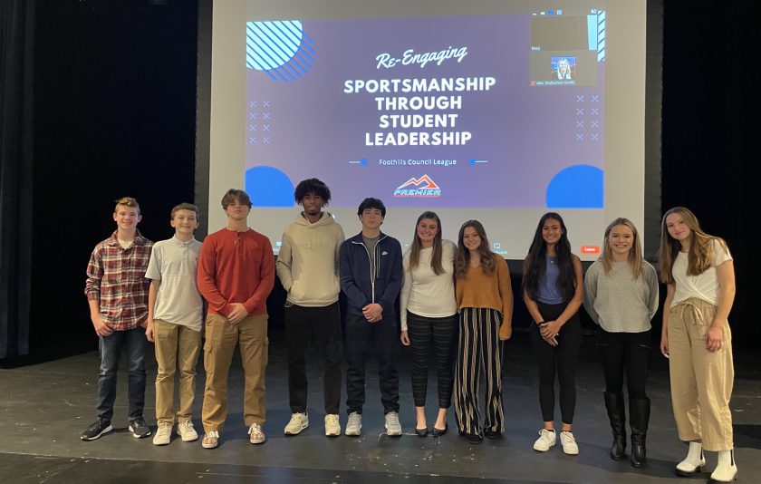 group of 10 students standing on stage