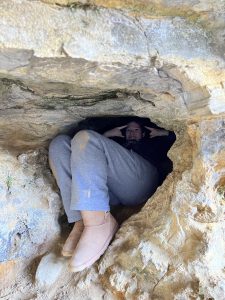 student hidden in a rock 
