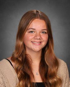 student with long brownish red hair