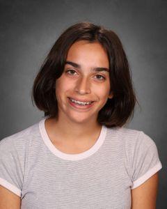 student with short bob haircut and braces