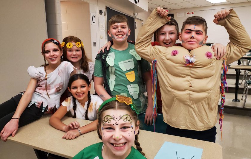 seven students dressed up in costumes and makeup