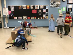 students wearing costumes acting in a classroom