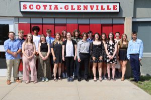 18 students standing outside under a sign that says Scotia-Glenville