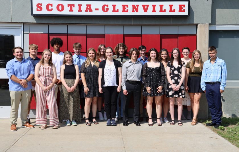 18 students standing outside under a sign that says Scotia-Glenville