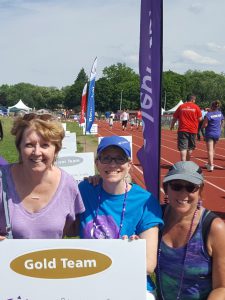 three women at a track for the Relay for Life
