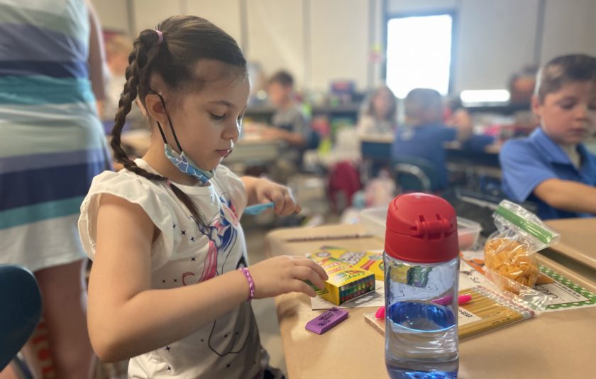 student getting a new crayon