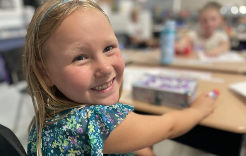 student turns to smile