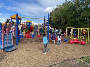 kids enjoying colorful playground equipment