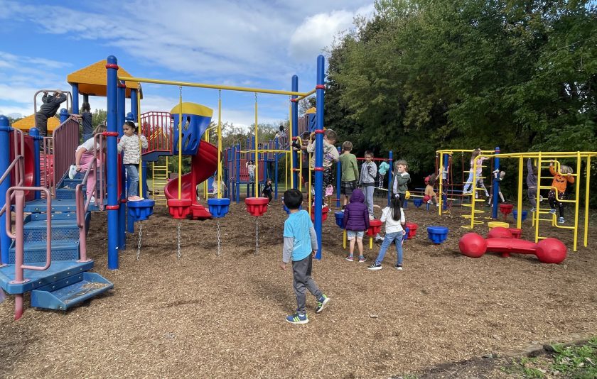 kids enjoying colorful playground equipment