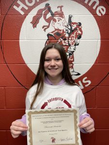 student with long brown hair holds a certificate