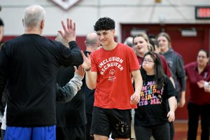 teams slapping hands after game