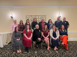 all award winners standing and sitting together