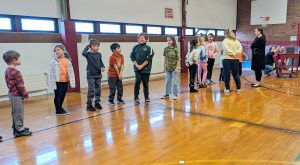 students standing in line in the gym