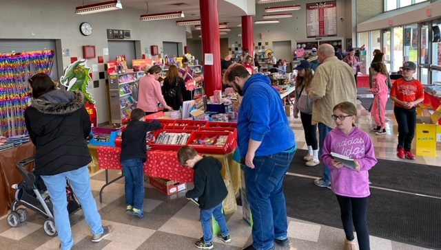 children and adults at bookstore