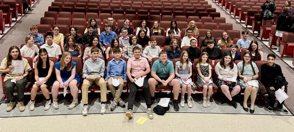 45 students sitting together in an auditorium